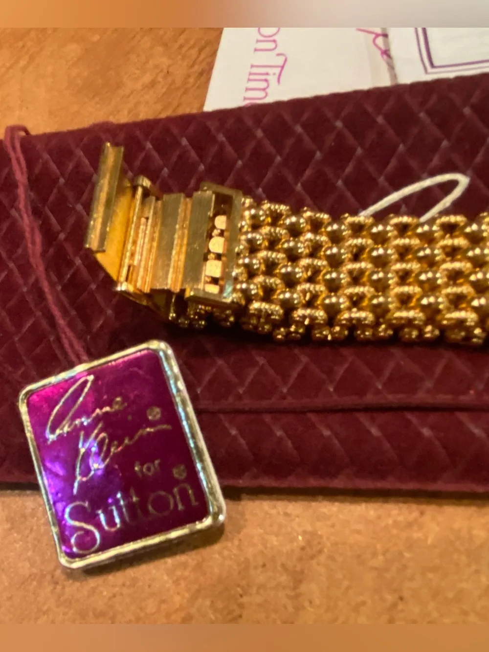 Anne Klein Gold Mesh Bracelet Watch with Black Dial and Burgundy Case Sleeve